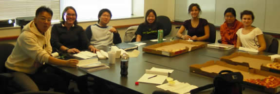 Lab members sitting around a table